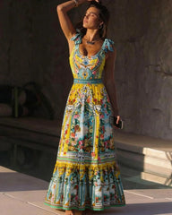 Woman wearing a vibrant print one-piece swimsuit with bow shoulder detail