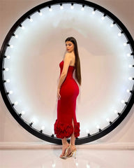 Back view of red corset gown with ruffled hem detail