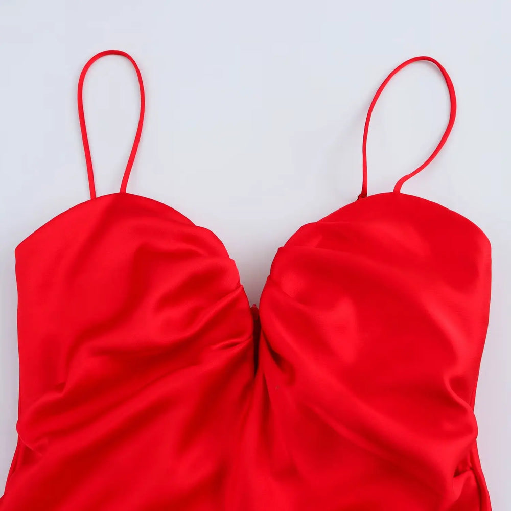 Red satin halter top on a white background