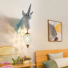 A charming crystal wall sconce with a whimsical design, illuminating a child's bedroom.  Golden Atelier 2