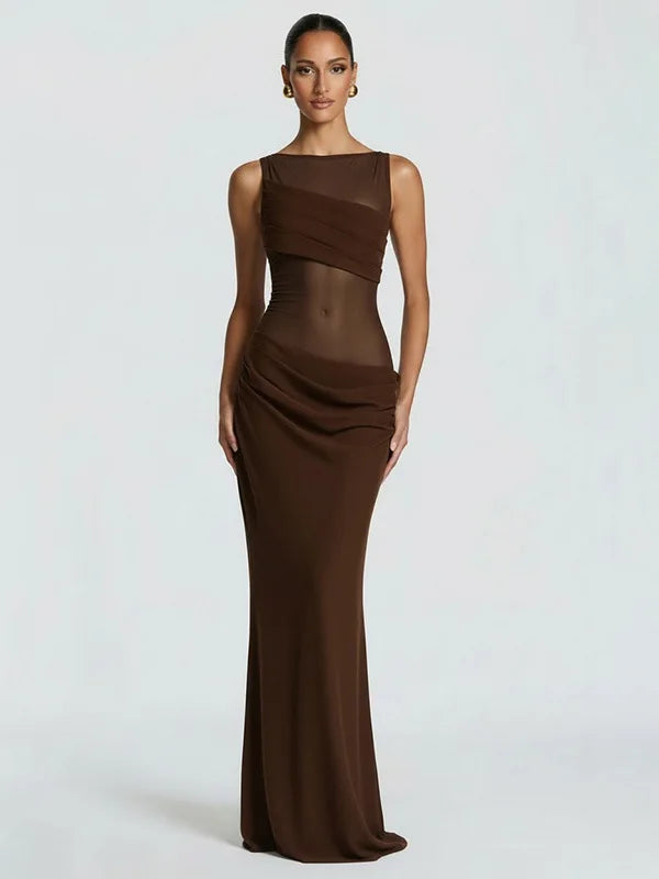 Woman wearing a brown evening gown on a white background