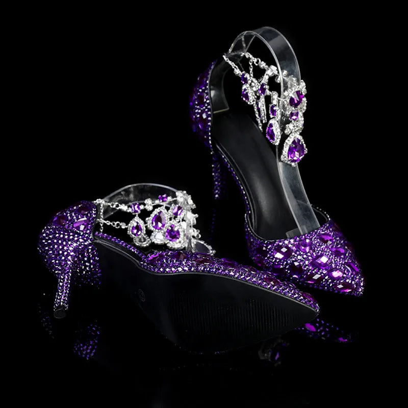 Purple high-heeled shoes with crystal embellishments on a black background