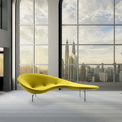 Curved pea-shaped designer sofa in modern living room with abstract art

