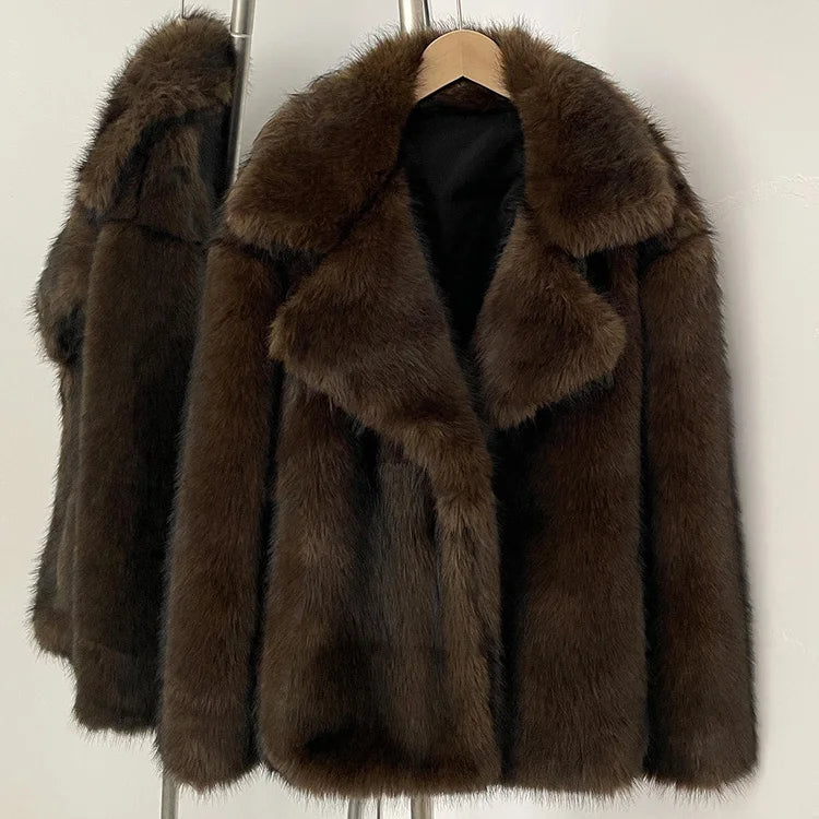 Brown fur coat on a hanger against a white background