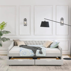 Modern bedroom with a gray upholstered bed, decorative pillows, and wall lights.