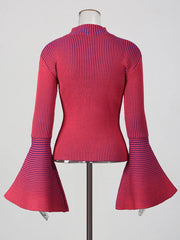 Red ribbed top with bell sleeves on a mannequin against a white background