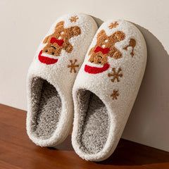 Gingerbread man slipper held in hand