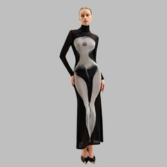 Model wearing a black and white dress with a high neckline on a plain background