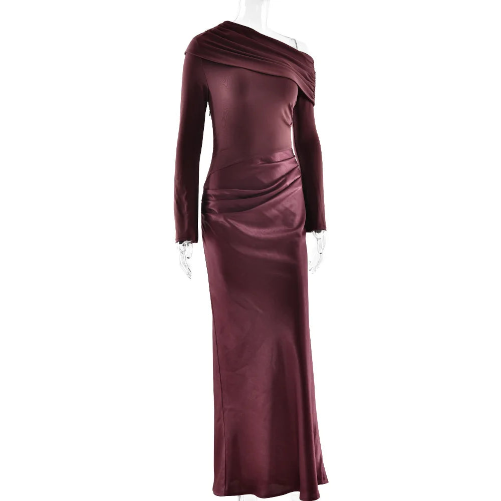 Mauve evening gown on a mannequin against a white background