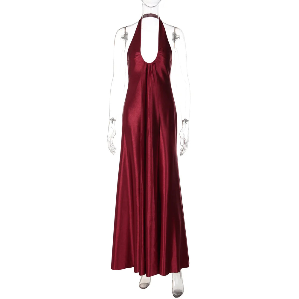 Red satin halter neck gown on a mannequin against a white background