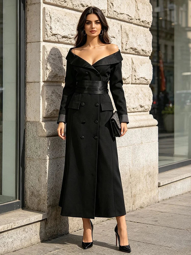 Model wearing a black double-breasted maxi blazer dress outdoors