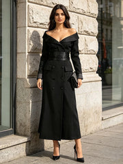Model wearing a black double-breasted maxi blazer dress outdoors