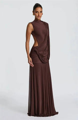 Model wearing a brown draped mock neck sleeveless maxi dress
