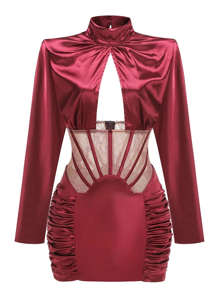 Red satin dress with long sleeves and sheer mesh panels on a white background