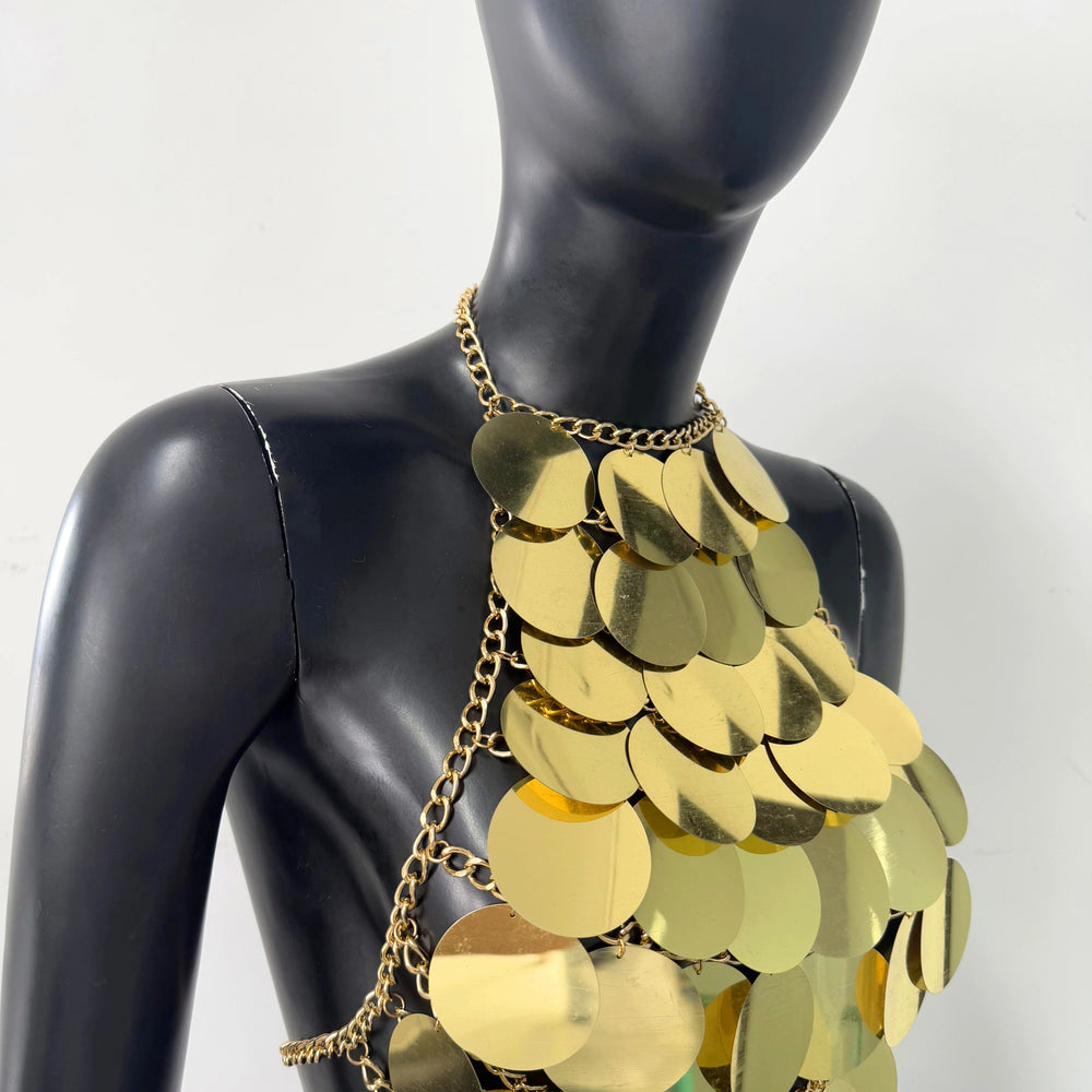 Gold sequin halter top on a mannequin, close-up