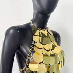 Gold sequin halter top on a mannequin, close-up