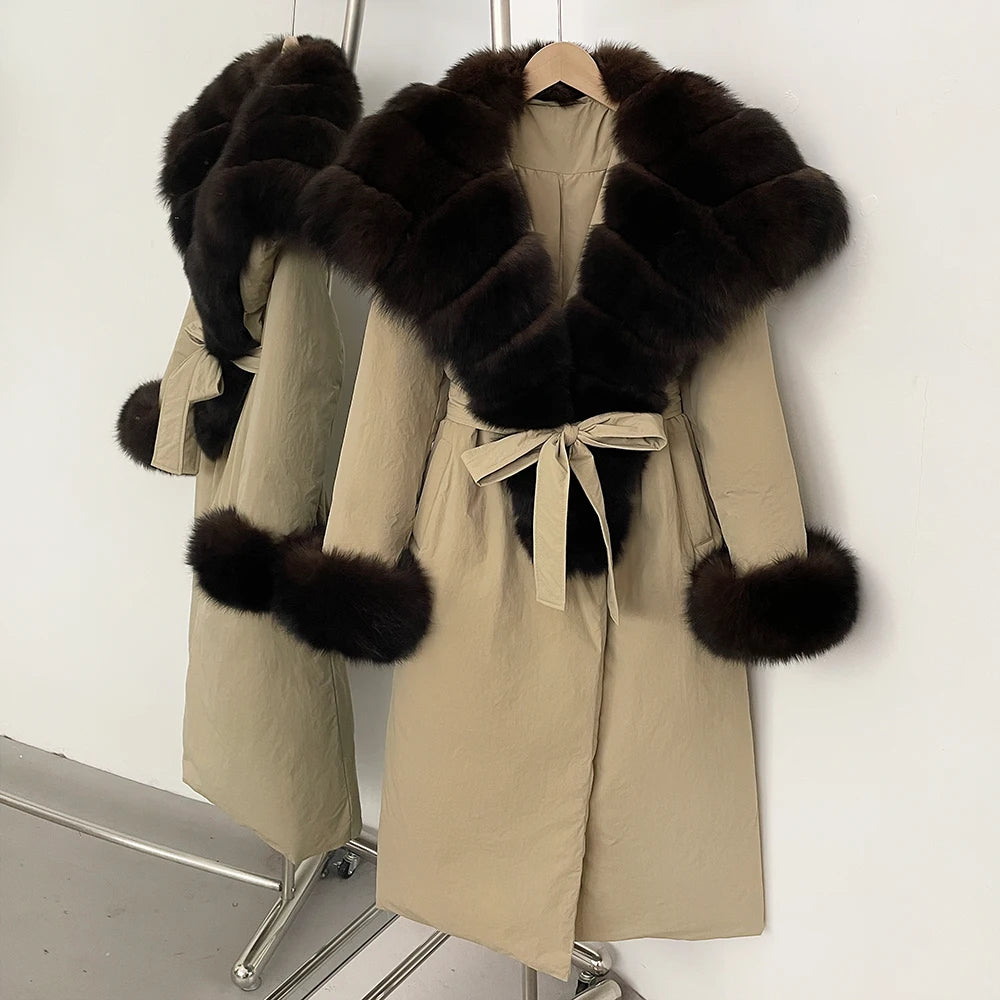 Beige trench coat with black fur trim on a white background