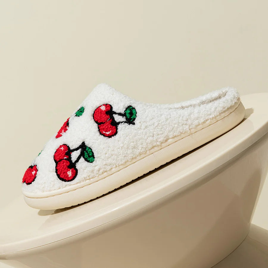 Side view of a white plush cherry slipper