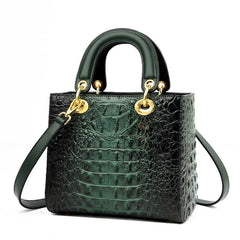  Close-up of the crocodile pattern texture on a top handle handbag, highlighting the luxurious detailing and craftsmanship. Black4