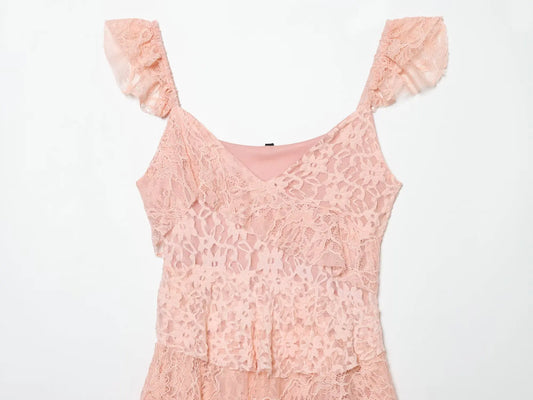 Close-up of the V-neck and lace detail on a pink mini dress