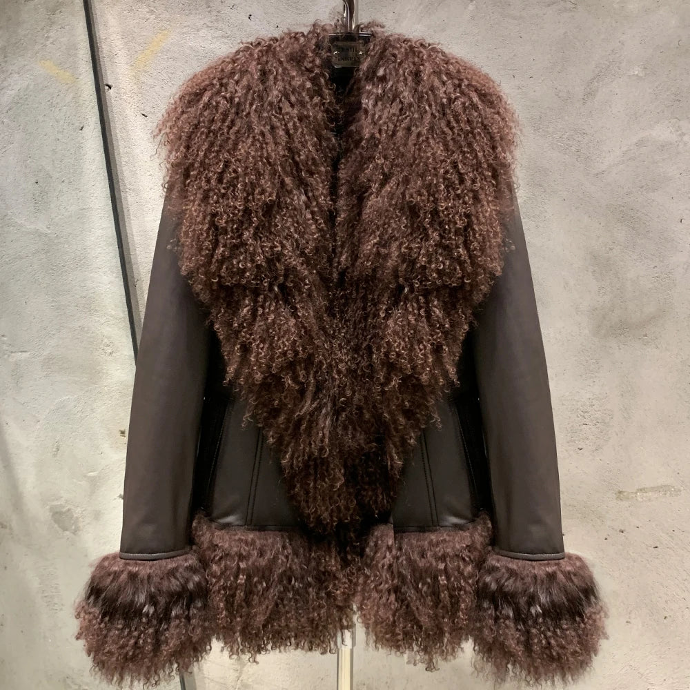 Brown fur vest with leather sleeves on a gray background