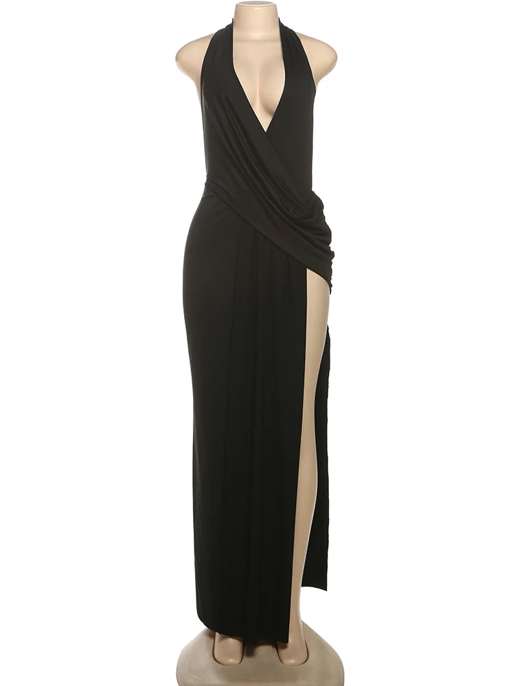 Black evening gown on a mannequin against a white background