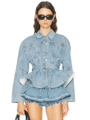 Model wearing a denim peplum jacket with belt and ruched shorts