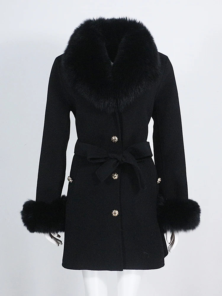 Black coat with fur trim on a white background