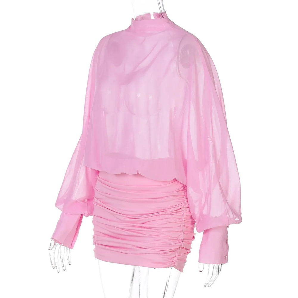 Pink ruched dress with sheer long-sleeve top on a white background