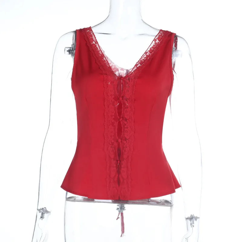 Red lace top on a mannequin against a white background