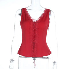 Red lace top on a mannequin against a white background