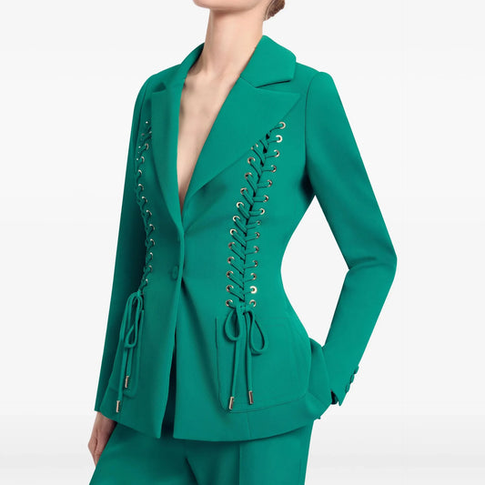Close-up of green lace-up blazer detail