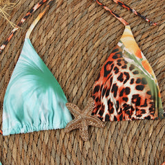 Close-up of a bikini top featuring leopard print and floral patterns.