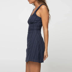 Navy blue dress worn by a person on a white background