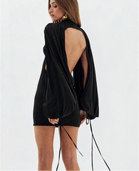 Back view of fuchsia puff sleeve turtleneck mini dress