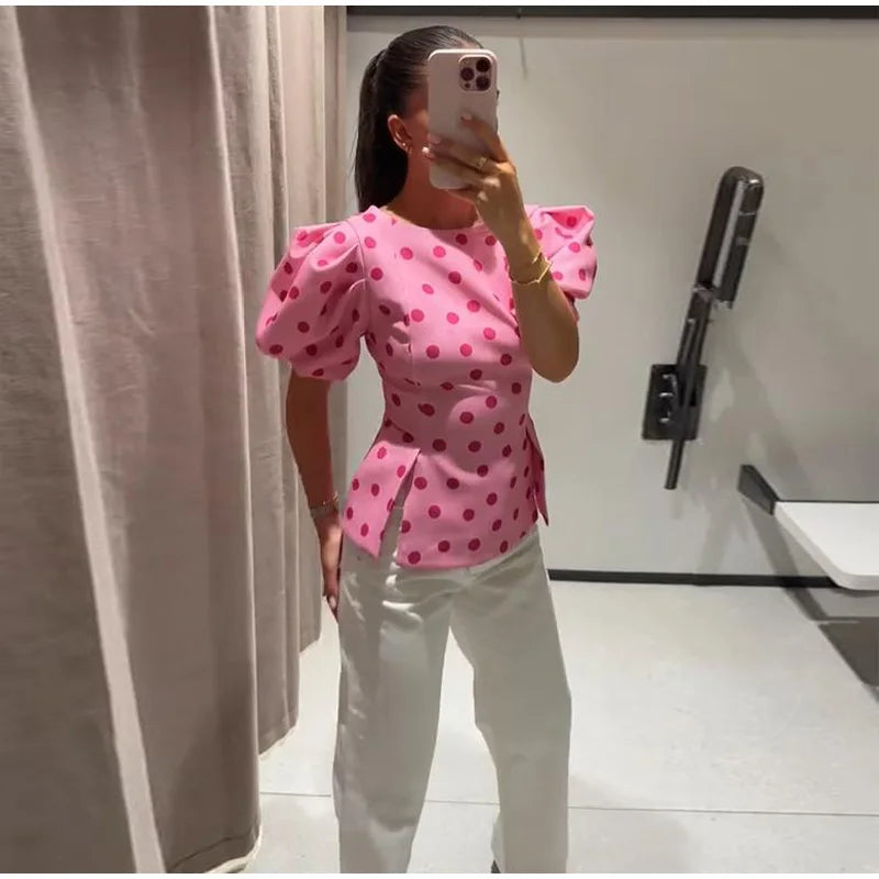 Pink polka dot puff sleeve peplum top side view