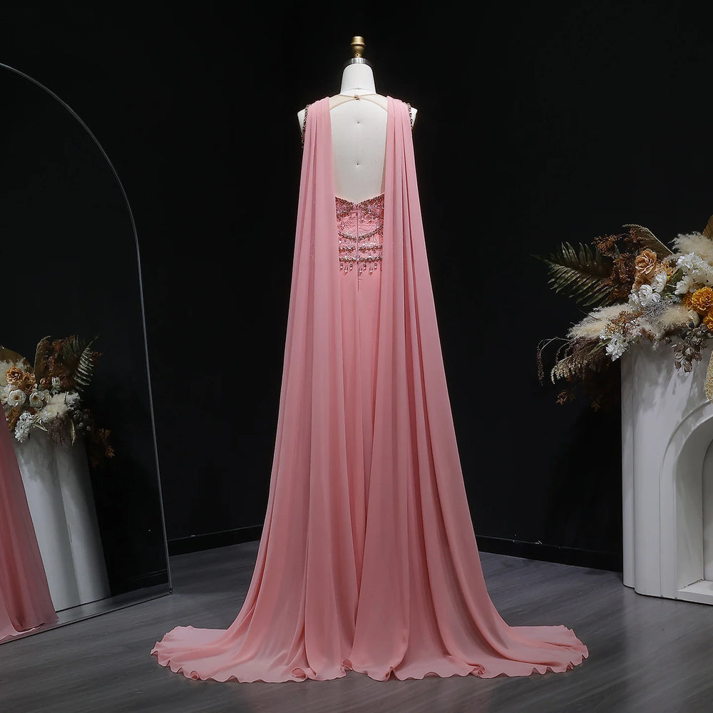 Pink evening gown on a mannequin with a dark background