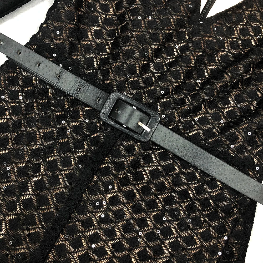 Black and gold patterned fabric with a gray belt