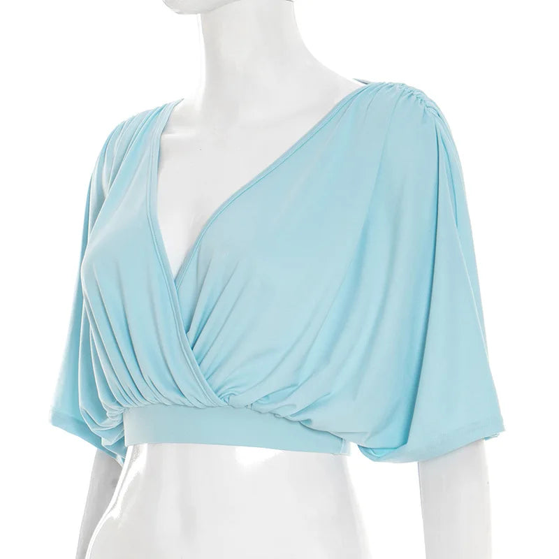 Light blue top on a mannequin against a white background