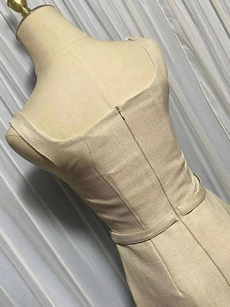 Beige dress on a mannequin against a neutral background