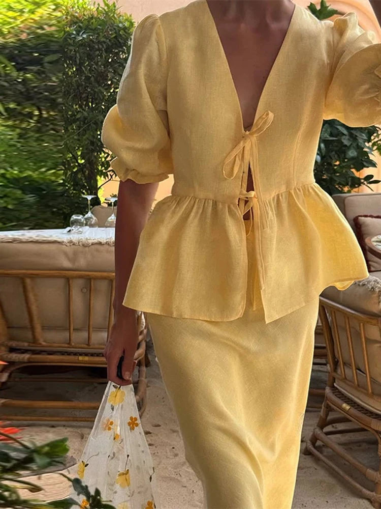 Person wearing a yellow outfit with a blurred background