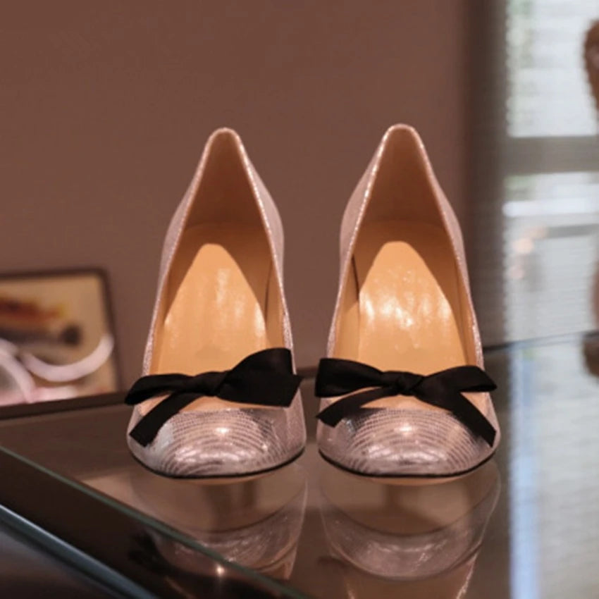 Silver bow high heels front view