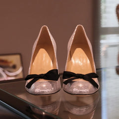 Silver bow high heels front view