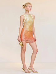 Woman wearing a colorful dress with a gradient effect on a plain background