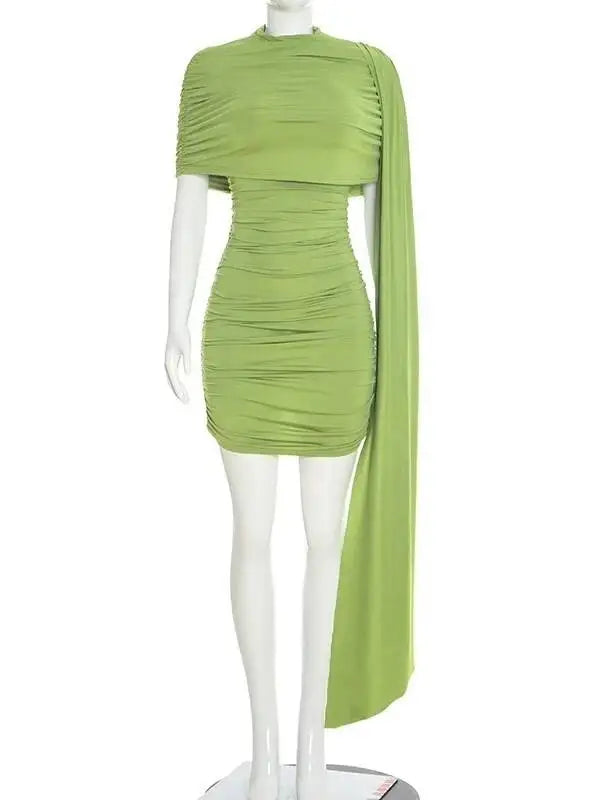 Green dress on a mannequin against a white background