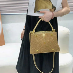 Stylish woman carrying a rhinestone crossbody handbag with a casual outfit, showcasing its versatility. Gold 2