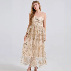 Woman wearing a floral lace dress on a white background