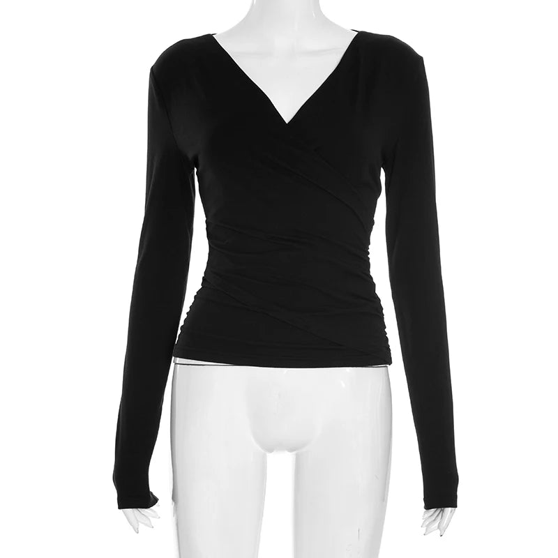 Black long-sleeve top on a mannequin against a white background