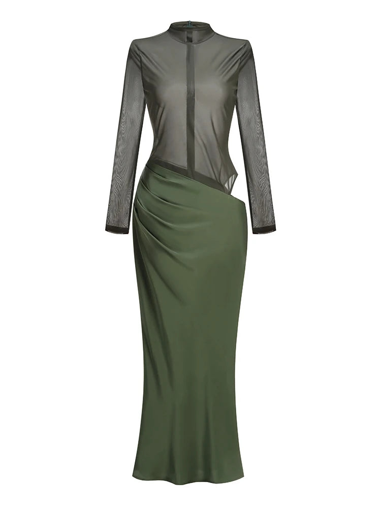 Green dress with sheer long sleeves on a white background