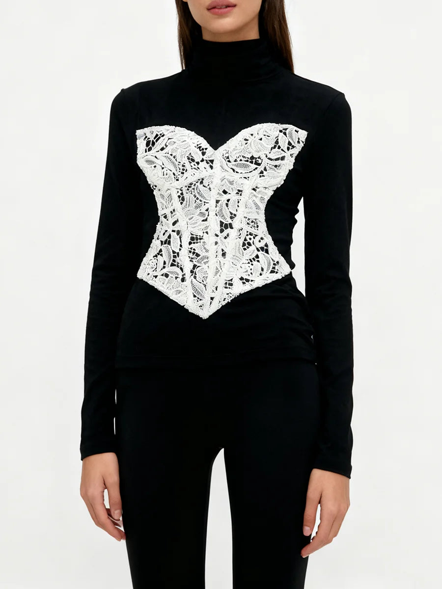 Black turtleneck sweater with white lace design on a white background